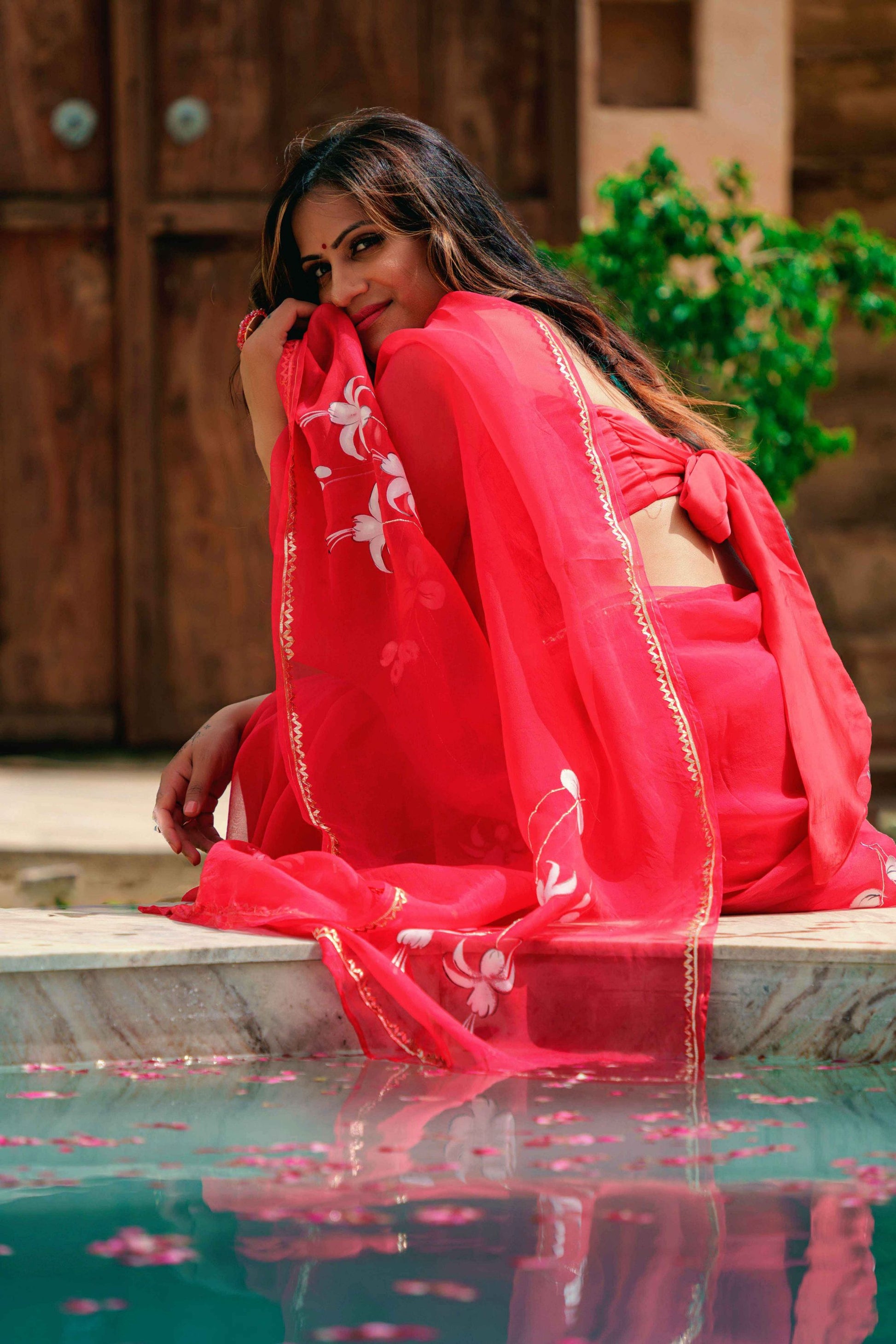 Hand-Painted Red Pure Silk Organza Saree with White Fuchsia Flowers and Metal Gota Embroidery - Perfect for Indian Weddings and Parties. Shop this Stunning Organza Saree Online for a Hot Saree Style. This Pure Silk Saree Features Exquisite Cloth Painting and Textile Paint for Fabric, Making it a Unique Hand-Painted Saree. Get the Saree Look You Desire with this Simple Saree Design. Explore Our Saree Shop for More Sadi Ka Design and Saree Options.