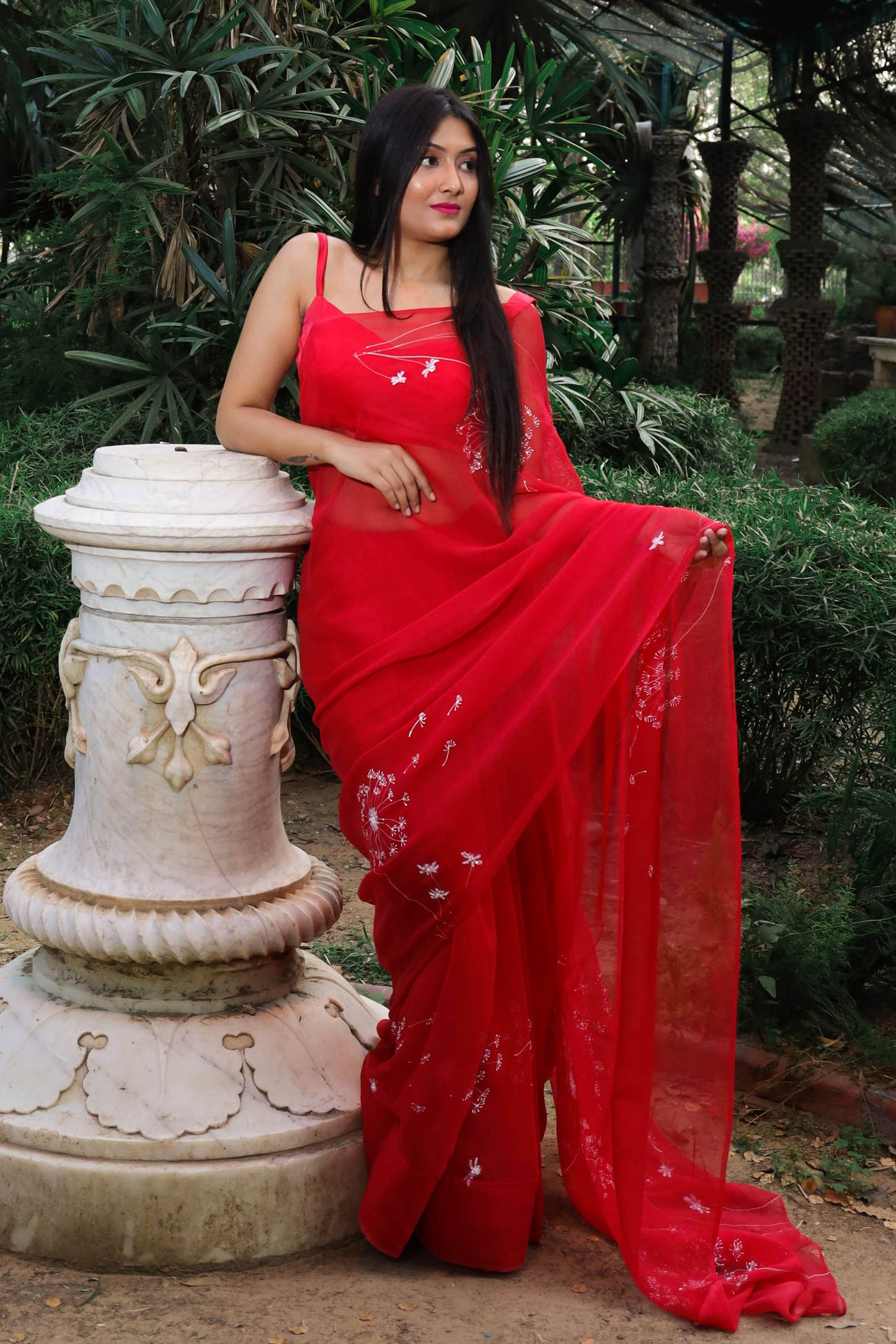 Hand painted red chiffon dandelion saree enhanced with sequin and pearl embroidery.