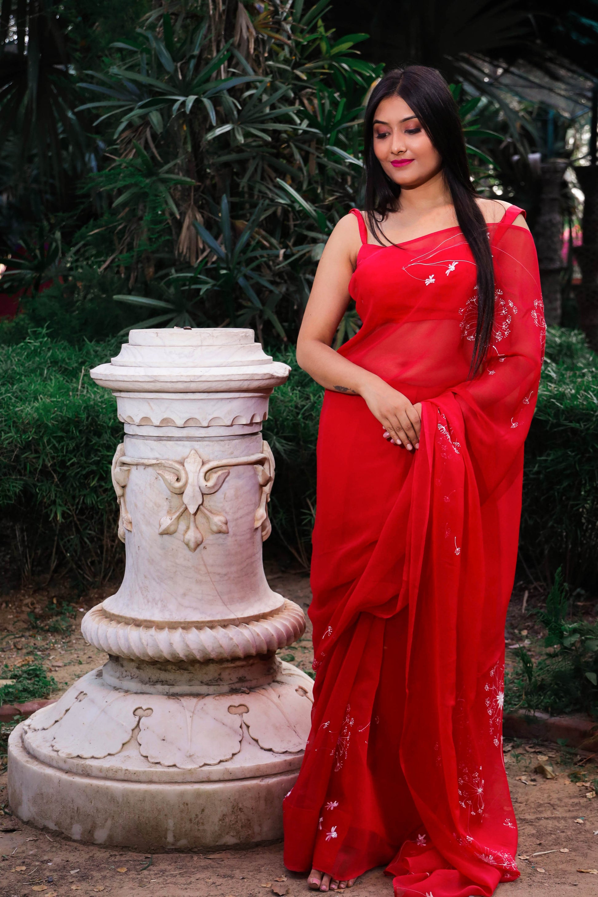 Hand painted red chiffon dandelion saree enhanced with sequin and pearl embroidery.
