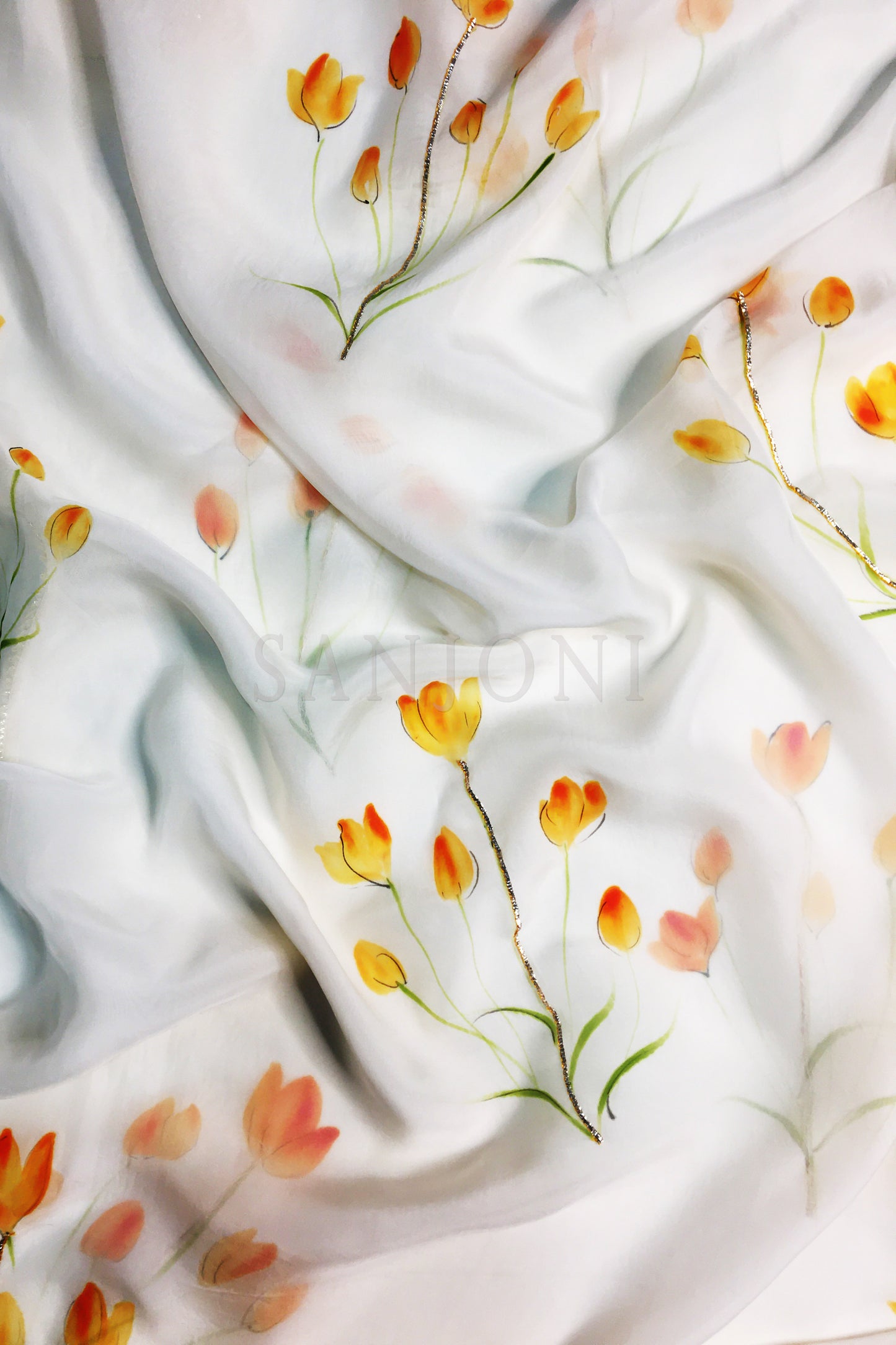 Hand painted suits with dupatta in silk fabric, orange lily flowers painted on silk a-line suit paired with painted organza dupatta and silk pants