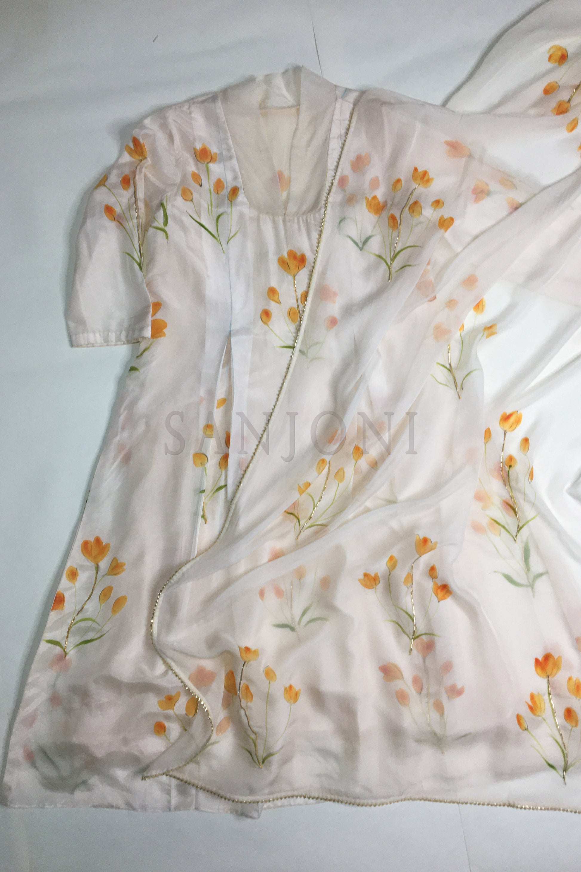 Hand painted suits with dupatta in silk fabric, orange lily flowers painted on silk a-line  suit paired with painted organza dupatta and silk pants