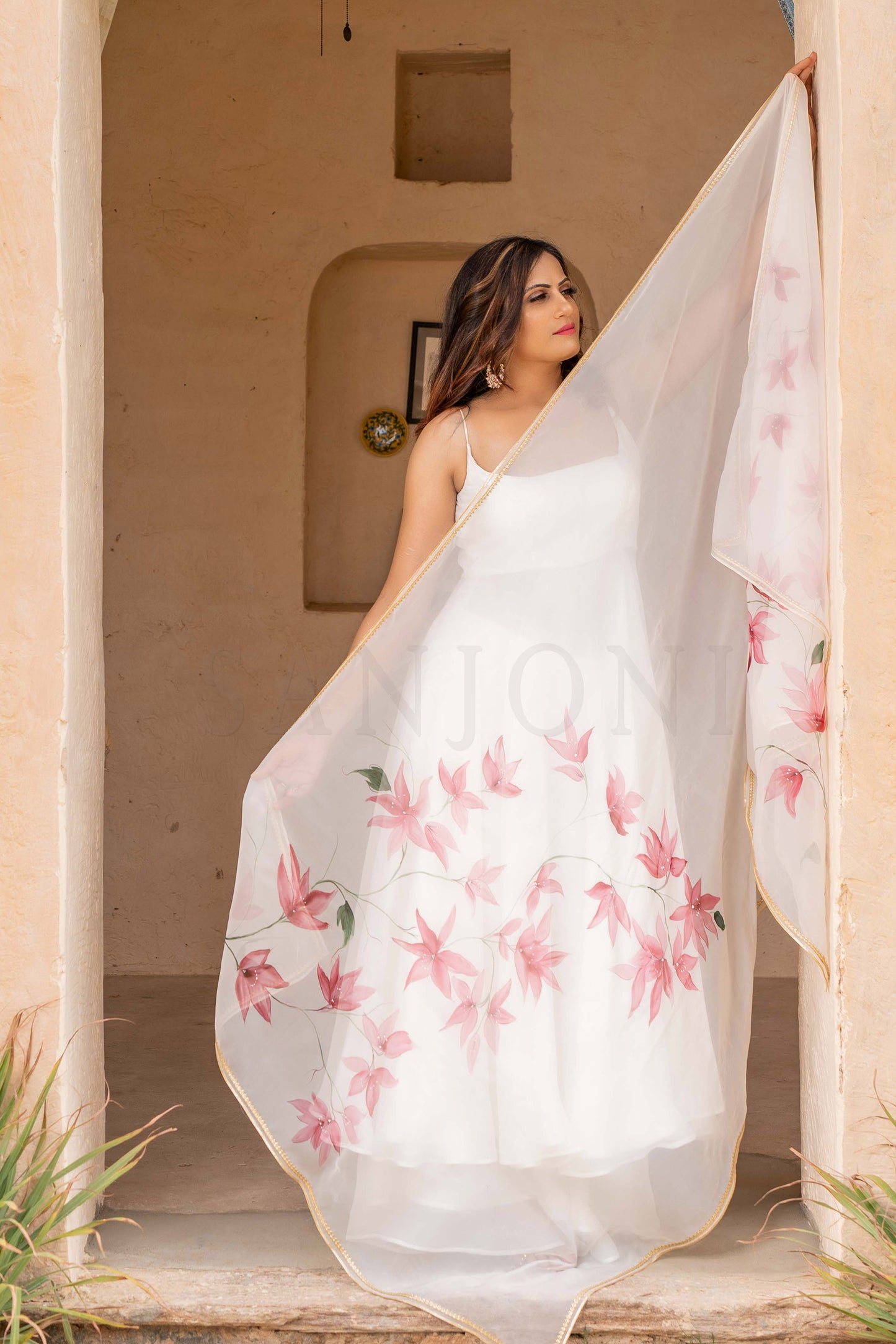 Hand painted white anarklai party wear enhanced with star flowers painted on organza dupatta