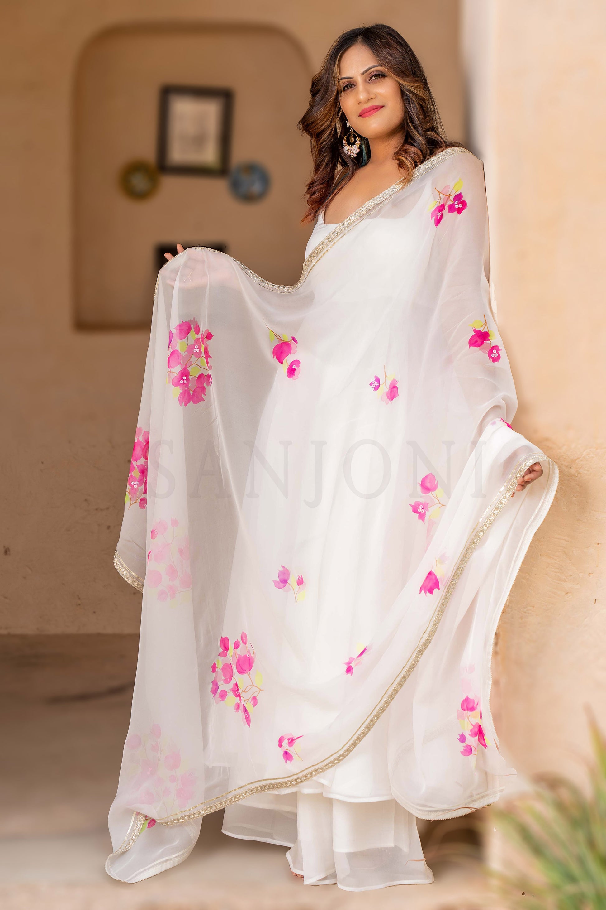 Fancy anarkali dress in white color with hand painted floral organza anarkali dupatta. enhanced with gota edging.