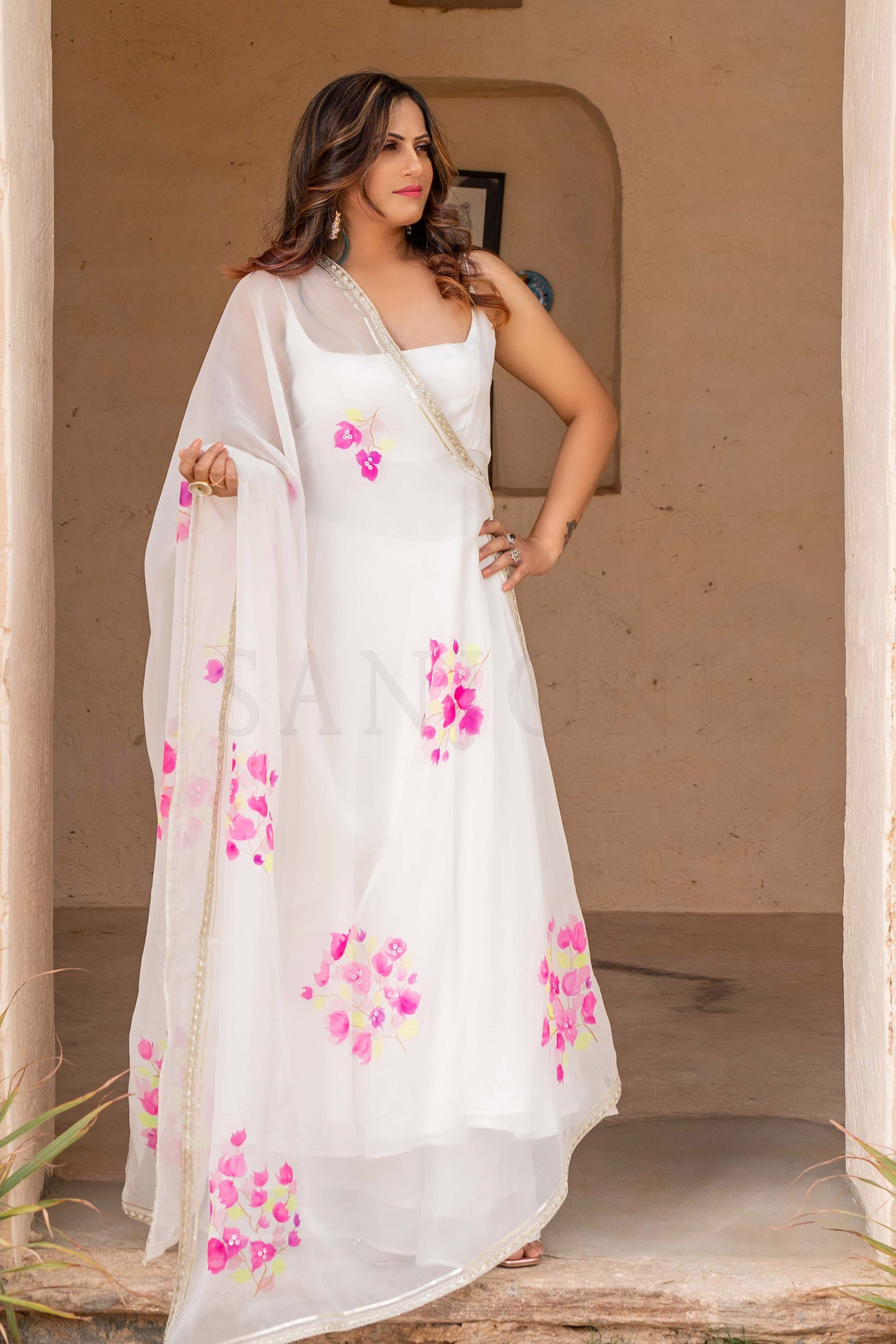 Fancy anarkali dress in white color with hand painted floral organza anarkali dupatta. enhanced with gota edging.