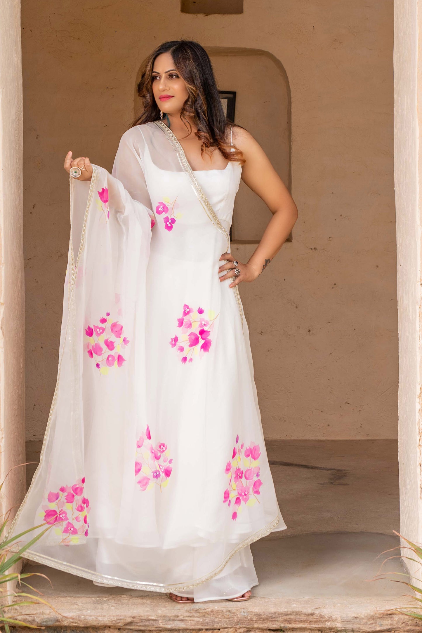 Fancy anarkali dress in white color with hand painted floral organza anarkali dupatta. enhanced with gota edging.