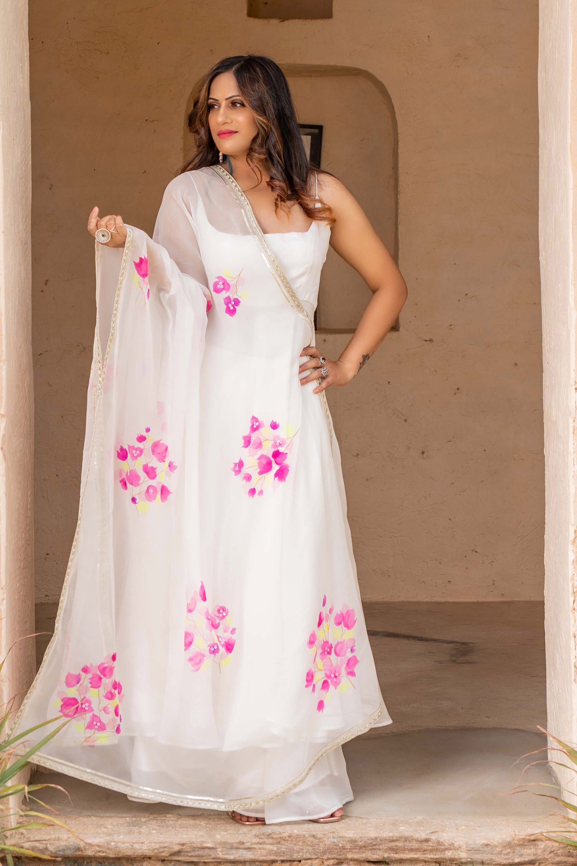 Fancy anarkali dress in white color with hand painted floral organza anarkali dupatta. enhanced with gota edging.