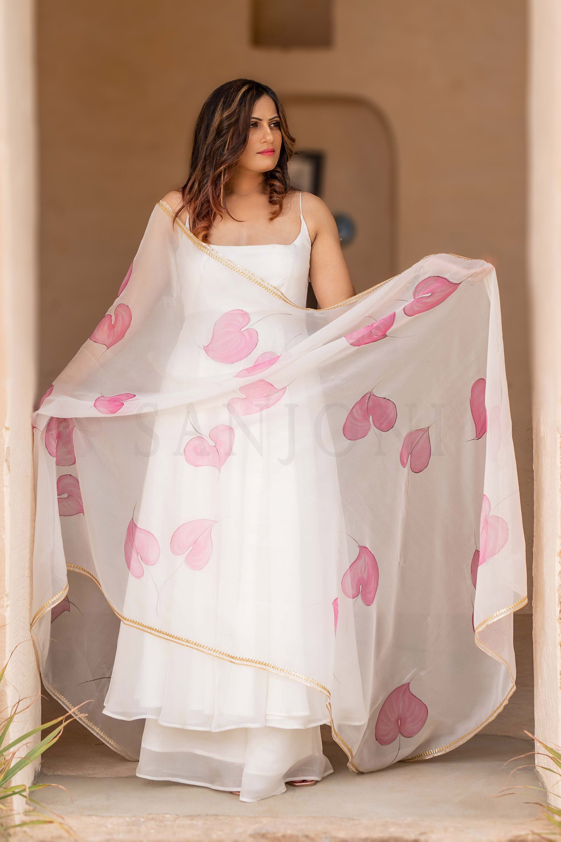 Fancy cala lily Hand painted anarkali with palazzo in white organza fabric.
