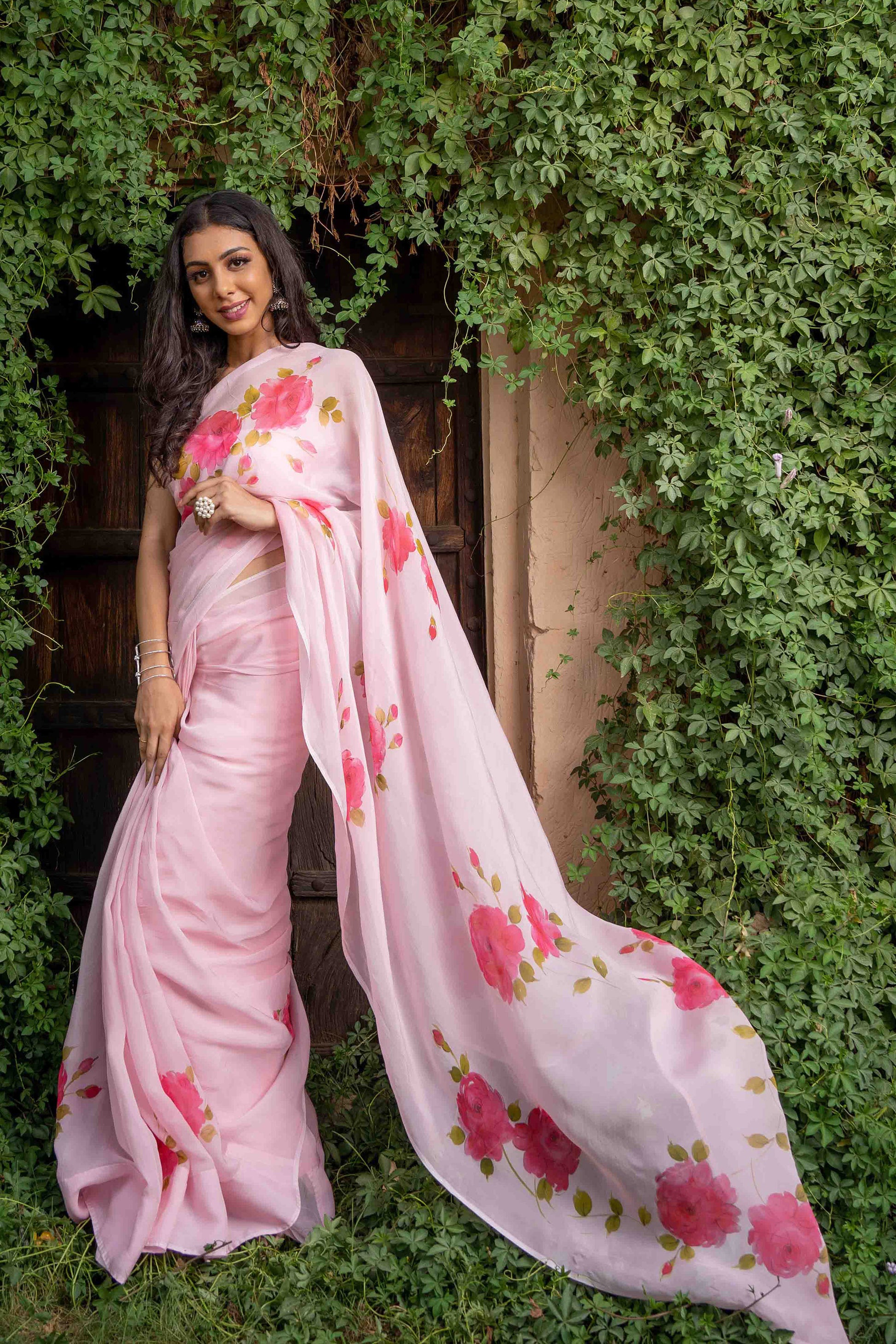 hand-painted fuchsia roses on  silk organza baby pink color saree