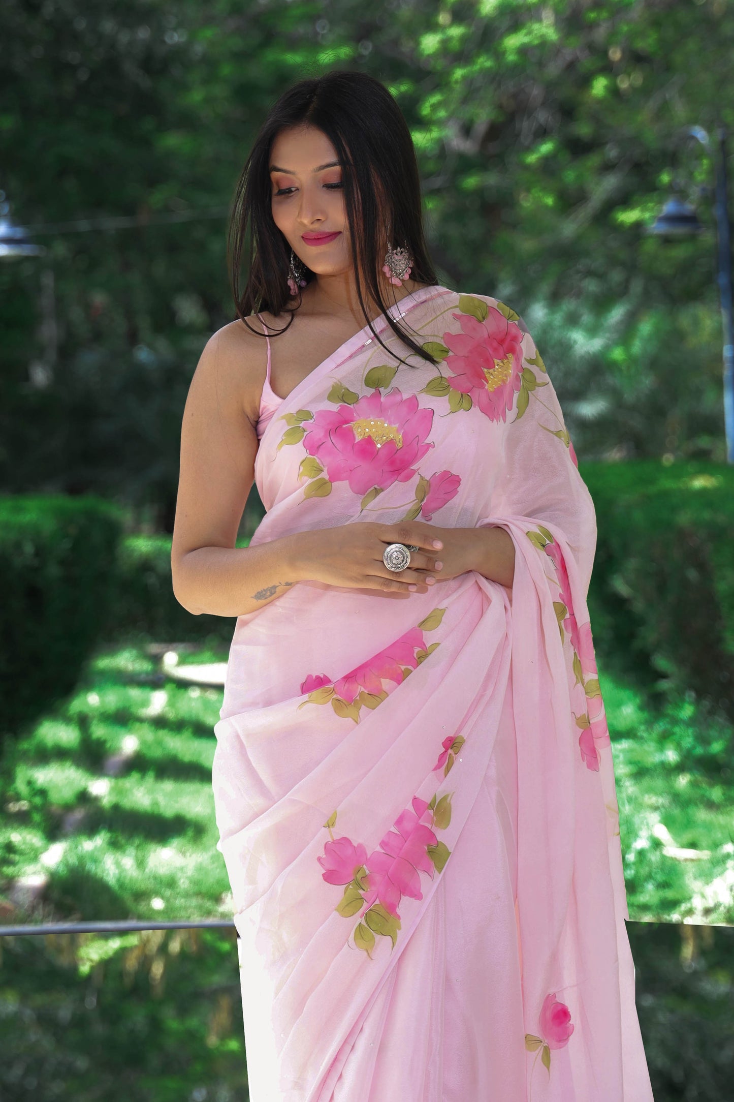 Hand painted wild peony floral saree in chinon chiffon fabric enhanced with sequin and bead hand embroidery.