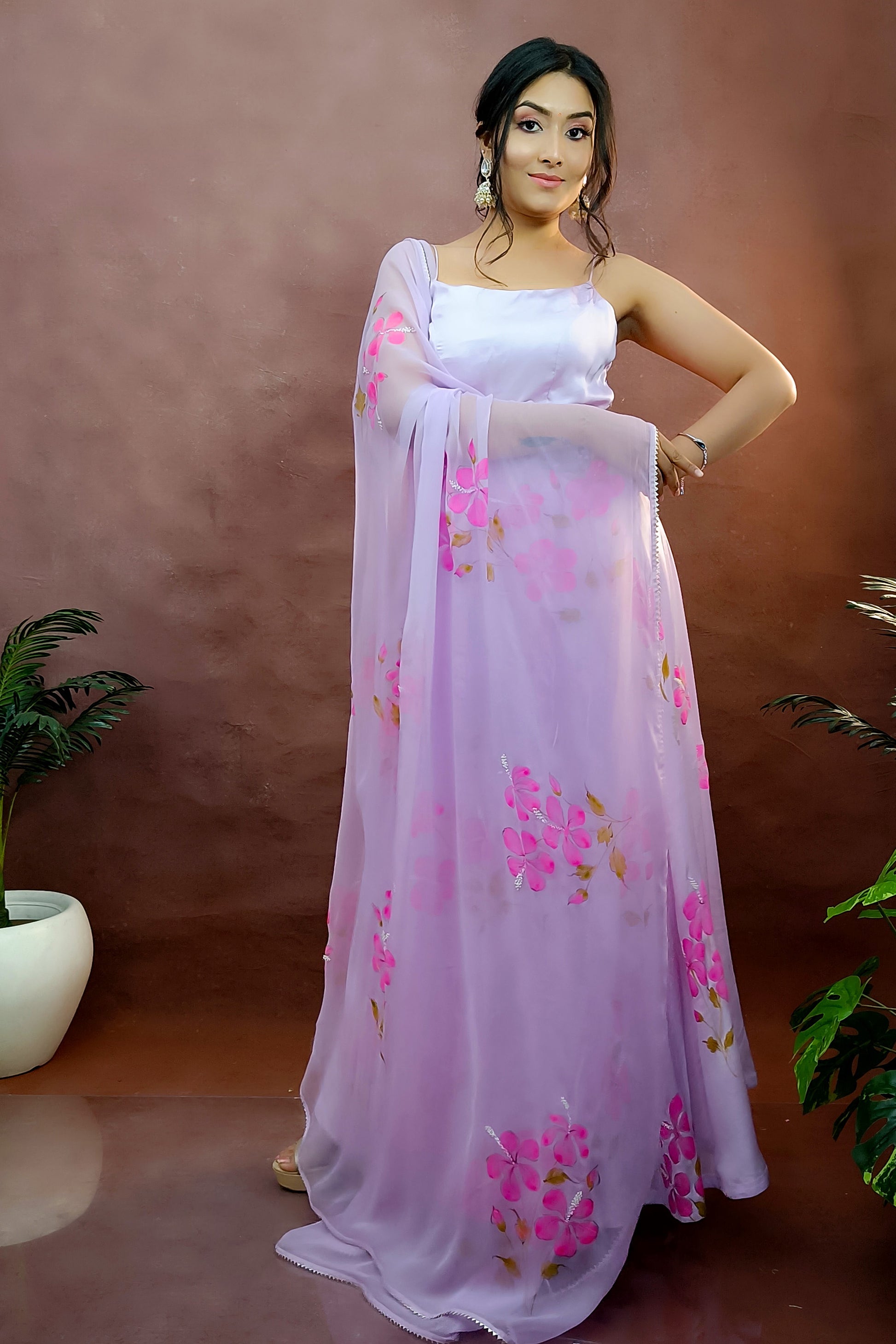 Hibiscus hand painted modal satin anarkali paired with chiffon dupatta adorned with pearl embroidery.