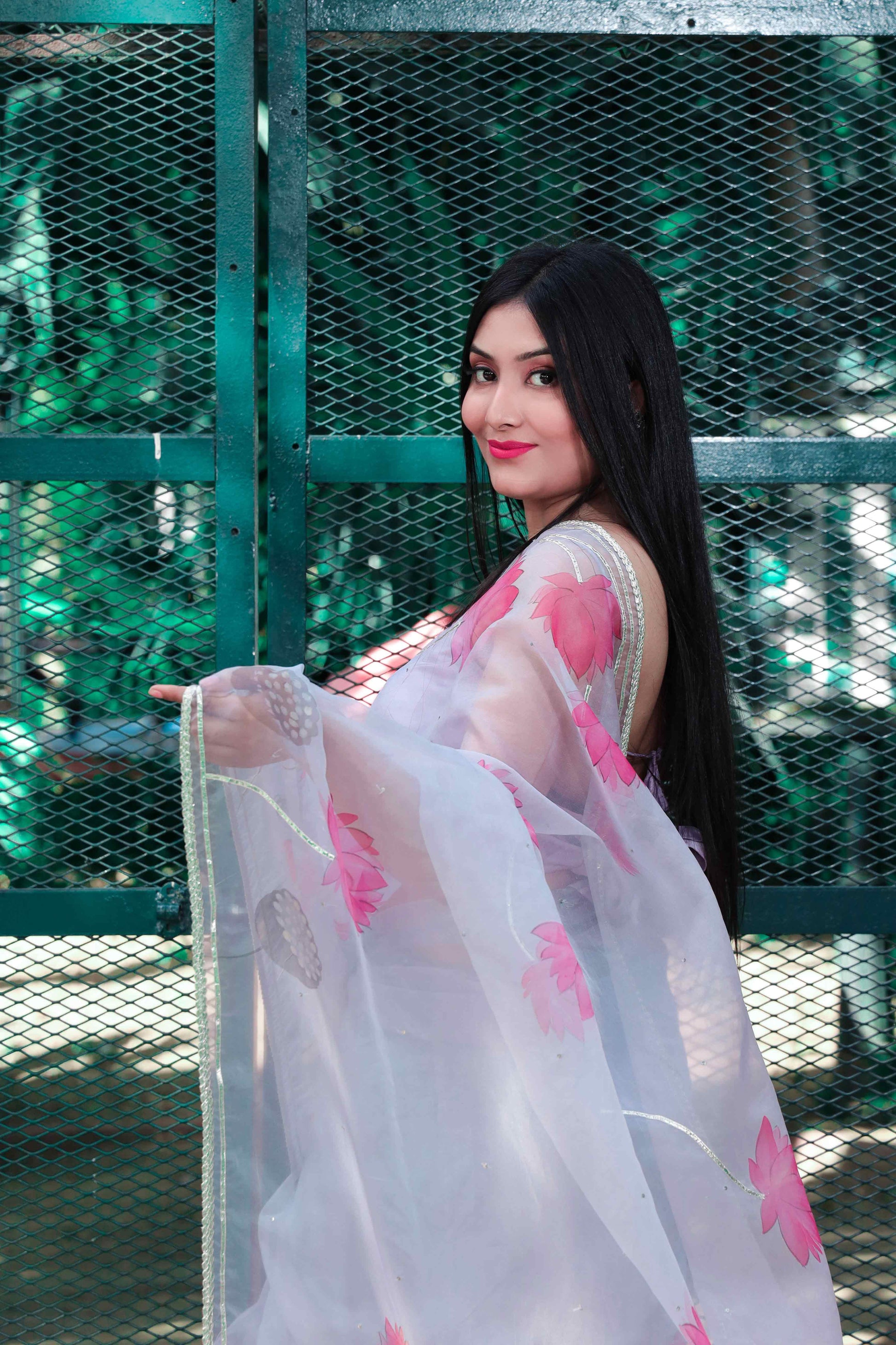 Grey Organza Saree Hand-Painted with Magenta Lotus Flowers and Gota Patti Embroidery - Perfect for Party Wear. Explore the Beauty of Hand-Painted Floral Organza Sarees and Unique Saree Designs. Ideal for an Elegant Organza Saree Look with Intricate Hand Painting