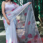 Grey Organza Saree Hand-Painted with Magenta Lotus Flowers and Gota Patti Embroidery - Perfect for Party Wear. Explore the Beauty of Hand-Painted Floral Organza Sarees and Unique Saree Designs. Ideal for an Elegant Organza Saree Look with Intricate Hand Painting