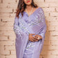 Lavender Satin Silk Saree Hand-Painted with White Apple Blossoms and Sequin Hand Embroidery - Perfect for Party Wear. Explore the Elegance of Hand-Painted Floral Sarees and Unique Saree Designs. Achieve a Hot Saree Style with This Pure Silk Saree. Ideal for an Engagement Look in Saree or a Farewell Saree Look. Discover Easy Hand-Painted Saree Design with Intricate Hand Painting. Elevate Your Saree Look for Weddings and Parties with This Beautiful and Stylish Indian Saree.