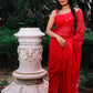 Hand painted red chiffon dandelion saree enhanced with sequin and pearl embroidery.