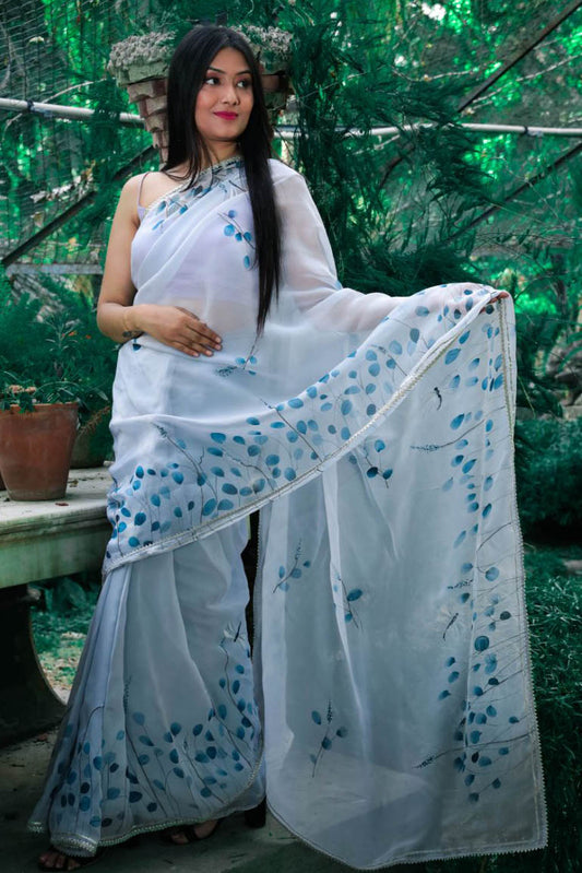 Hand painted grey color dragonfly organza saree enhanced with cut beads and gota detailing