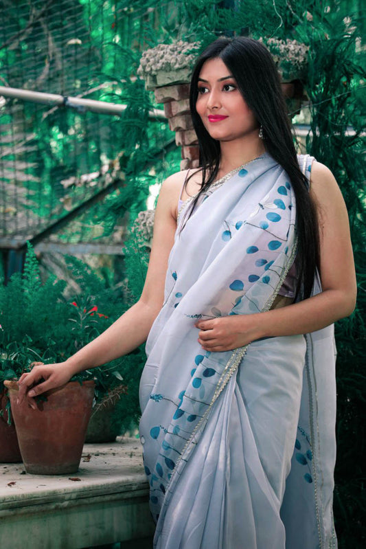 Hand painted grey color dragonfly organza saree enhanced with cut beads and gota detailing