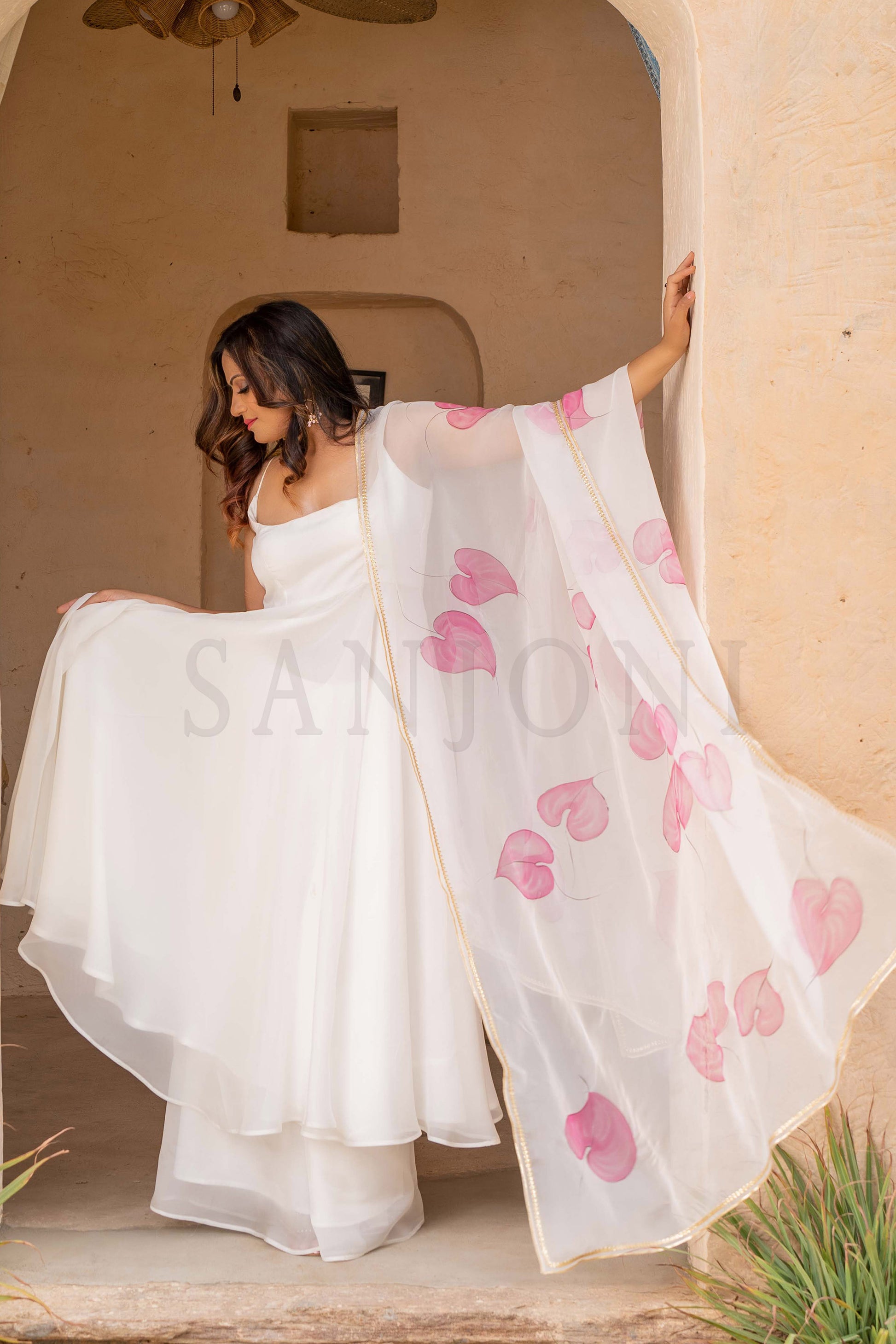 Fancy cala lily Hand painted anarkali with palazzo in white organza fabric.