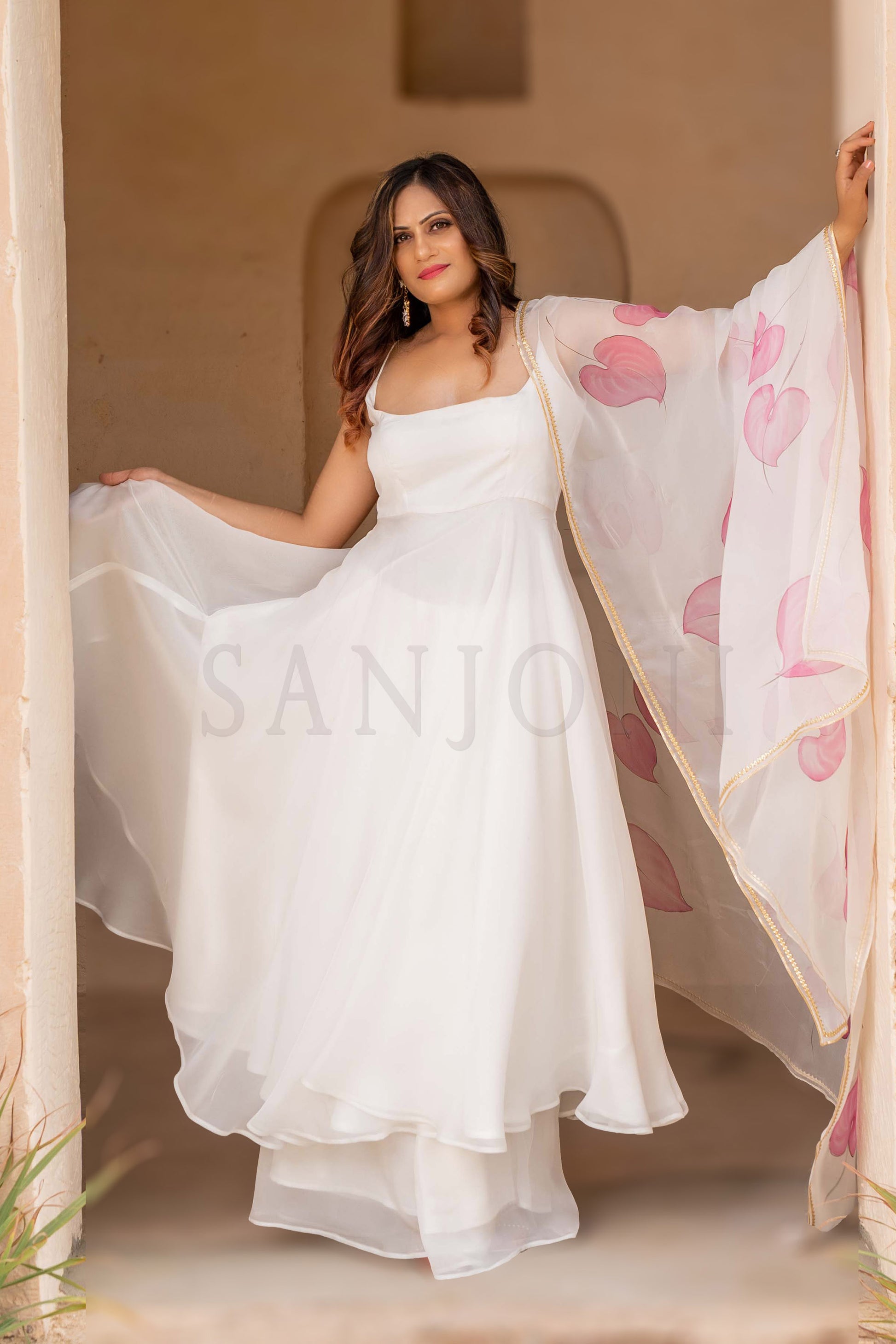 Fancy cala lily Hand painted anarkali with palazzo in white organza fabric.