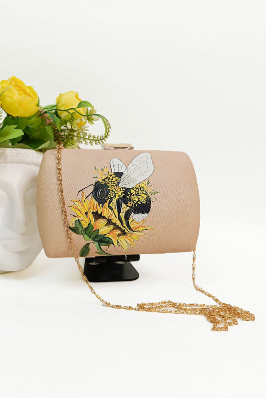 Unique Hand-Painted Canvas Clutch with Sling - Bumble Bee and Sunflower Design. Customized Hand-Painted Purse for a Personalized Touch. Explore Painted Canvas Bags and Bag Design Online. Perfect Evening Clutch for a Stylish Look. Get Your Customized Ladies Purse with Name. Discover the Beauty of Painted Designer Bags. Create Your Own Custom Purse and Customized Bag Near You