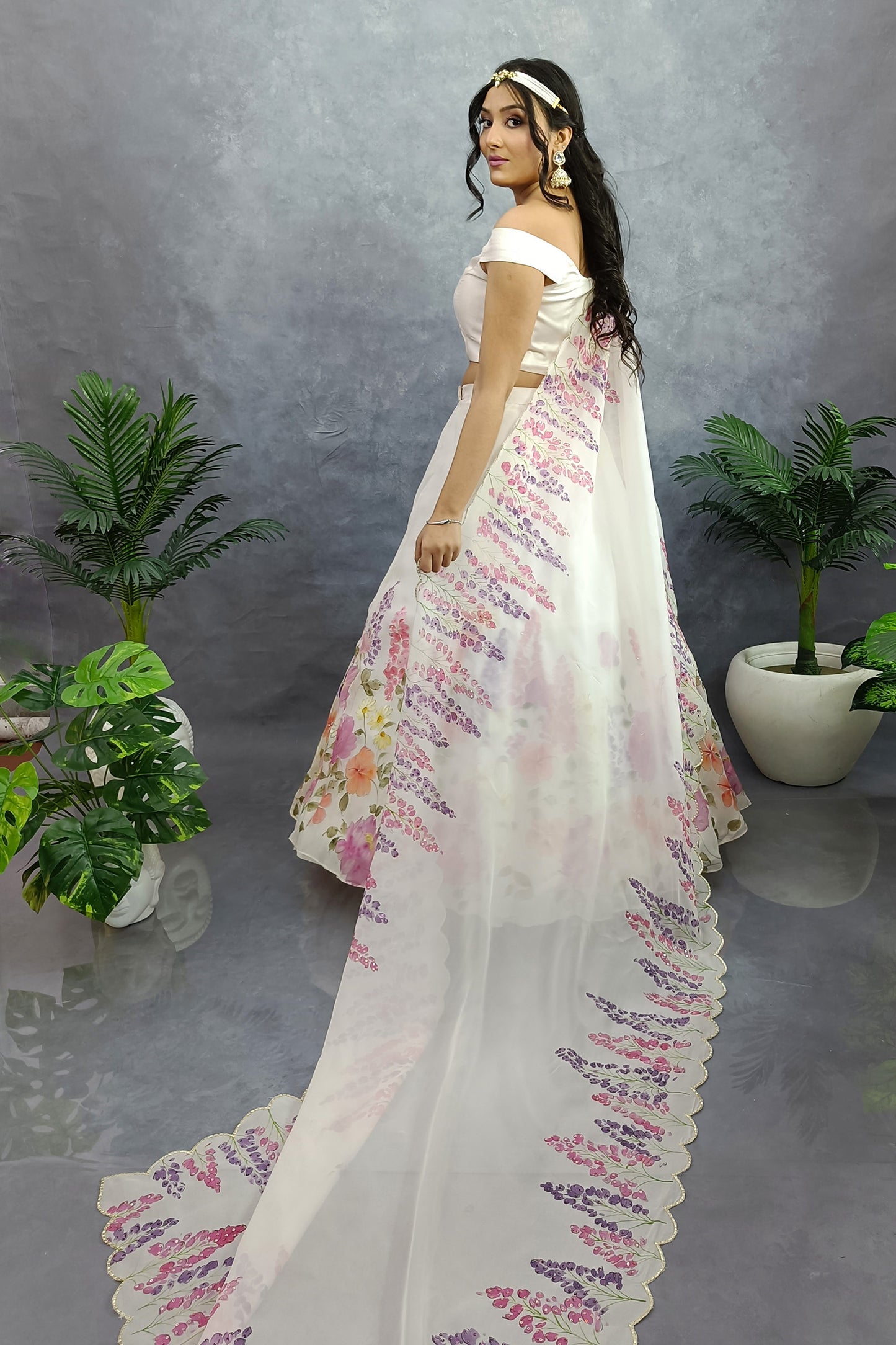 Hand painted hand embroidered winter garden organza lehenga in milky white color.