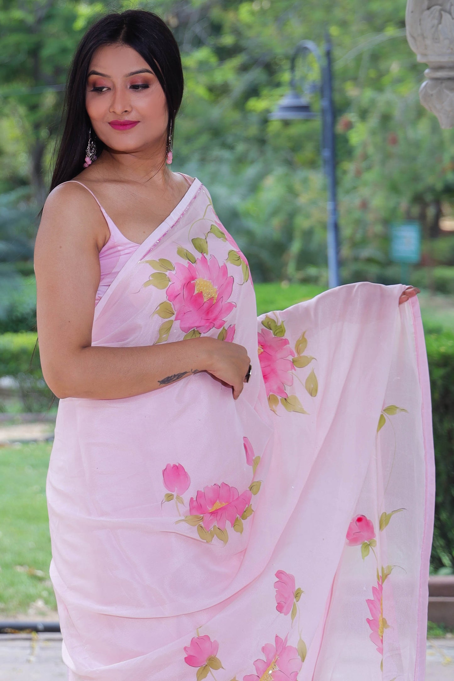 Hand painted wild peony floral saree in chinon chiffon fabric enhanced with sequin and bead hand embroidery.